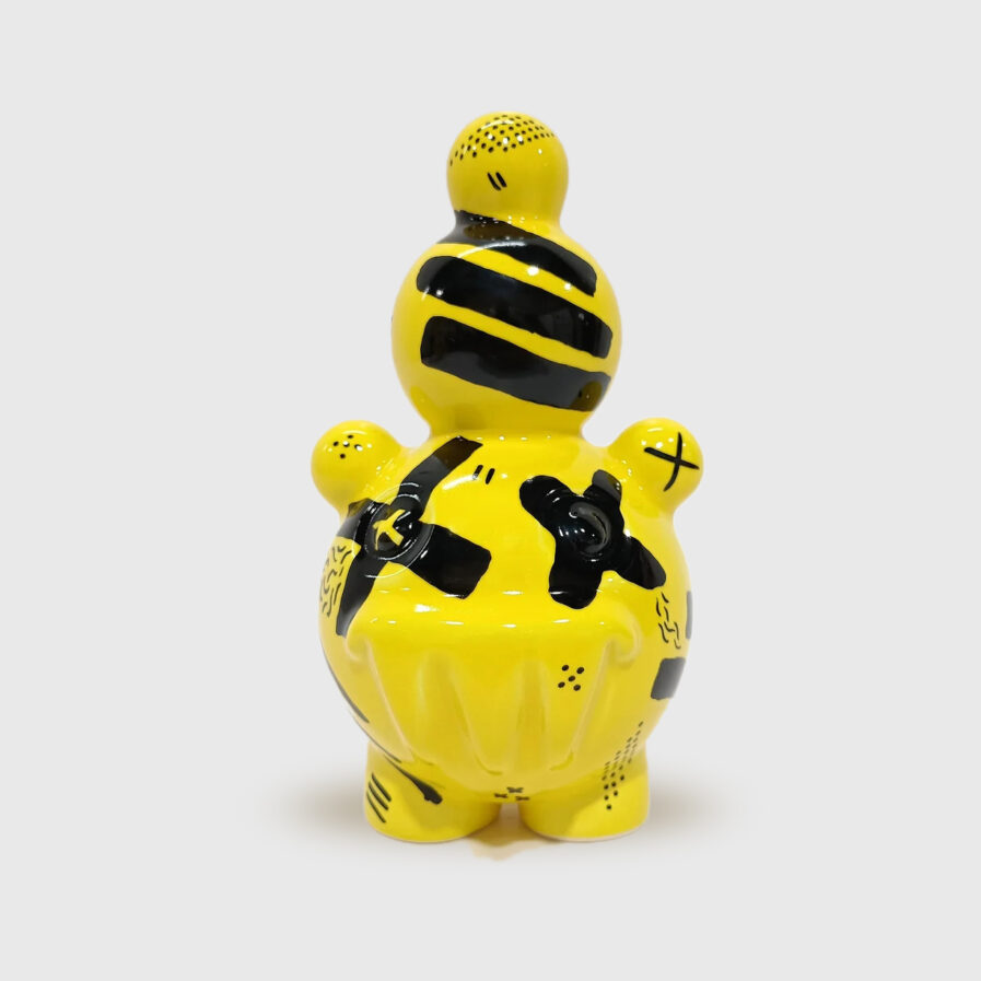 black and yellow ceramic creature by ricardo milne